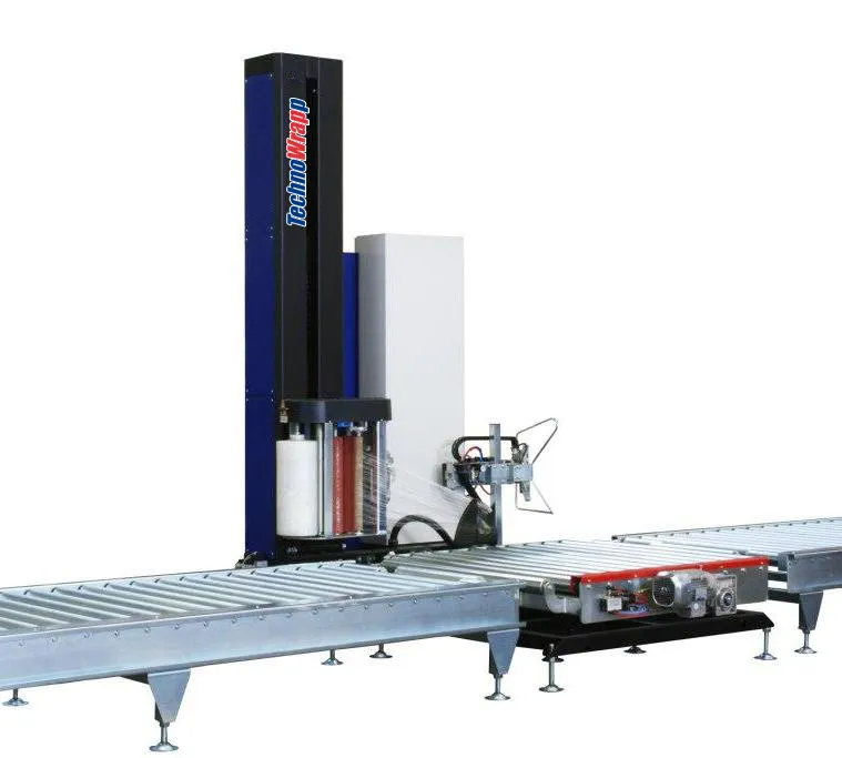 An automatic turntable stretch wrapper with a film tower beside a roller conveyor turntable.